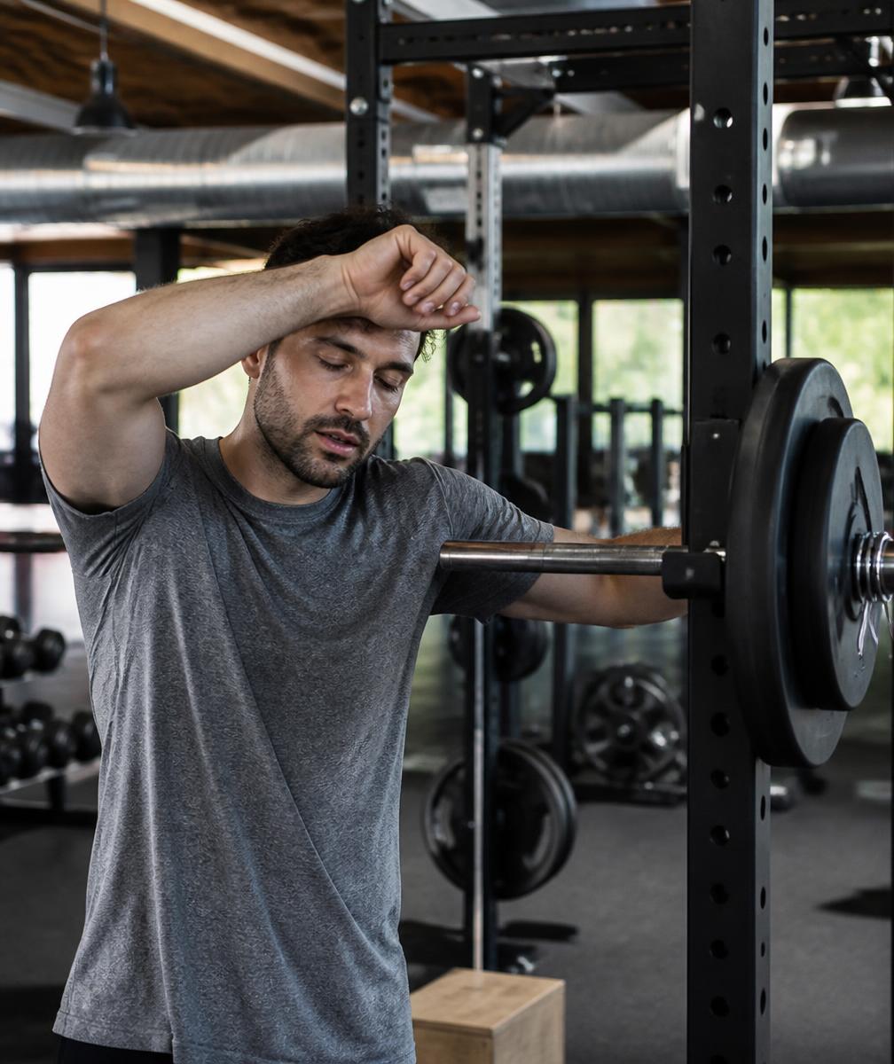 Client resting after a heavy set of squats during a strength training session